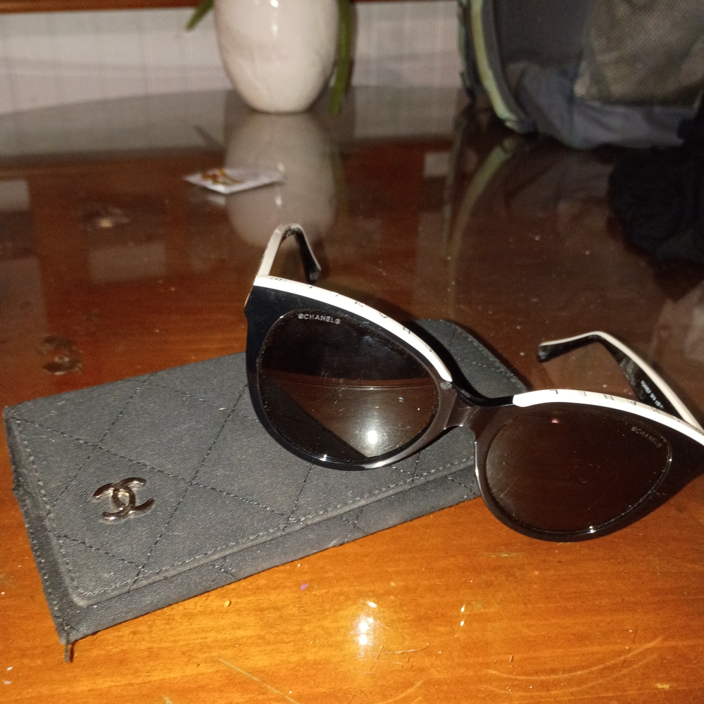 CHANEL Elegant Black Sunglasses with White Trim
